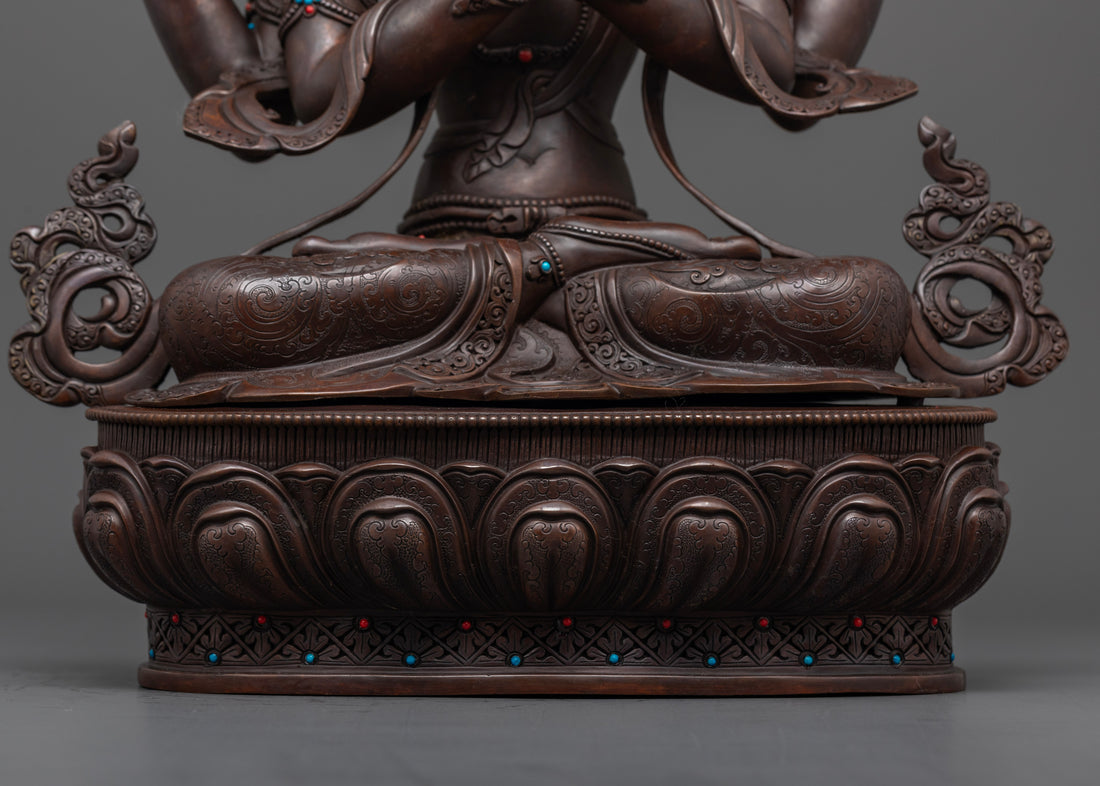 Chenrezig statue sitting on a moon disc upon a lotus seat