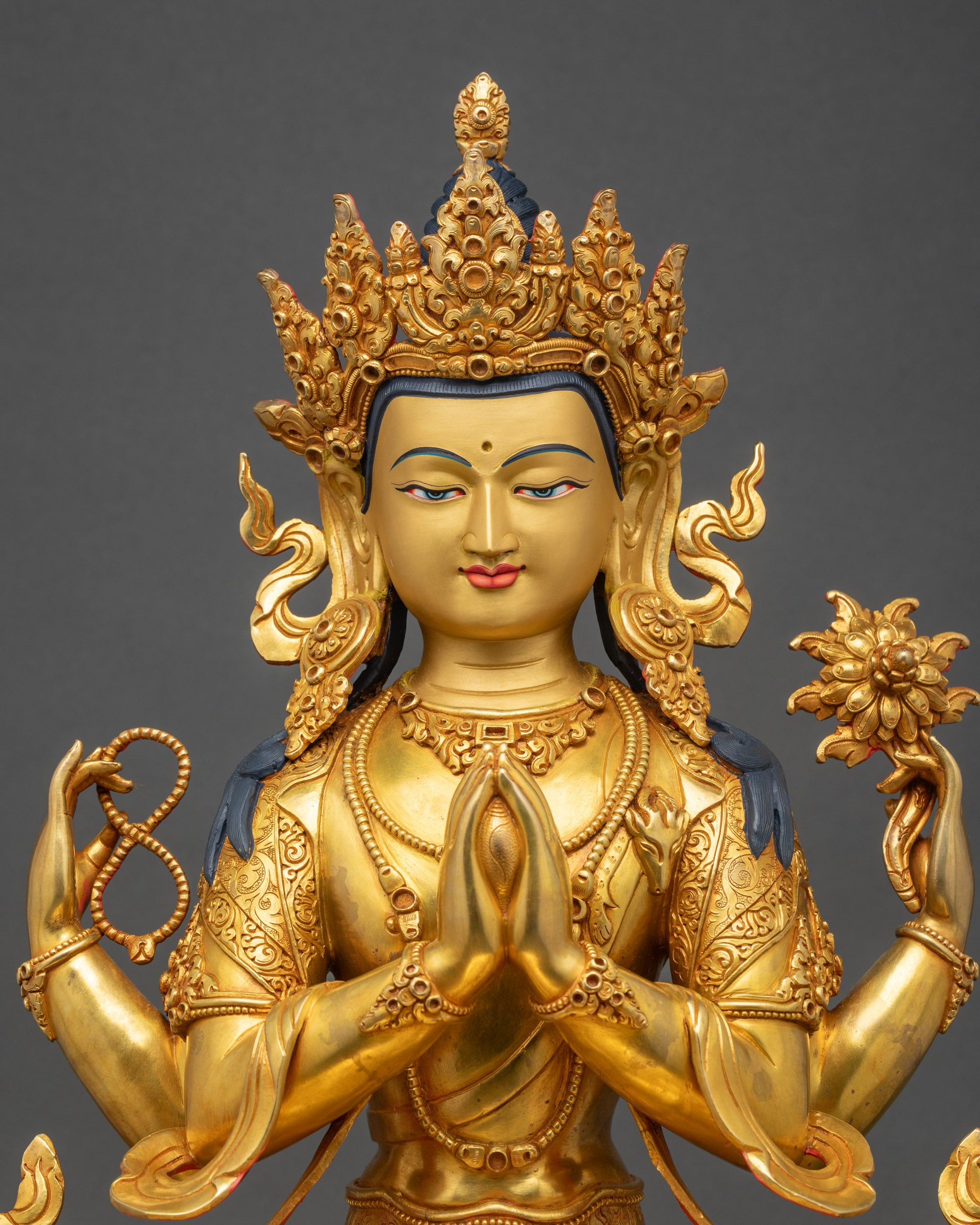 Chenrezig statue close up showing intricate robes and jewelry