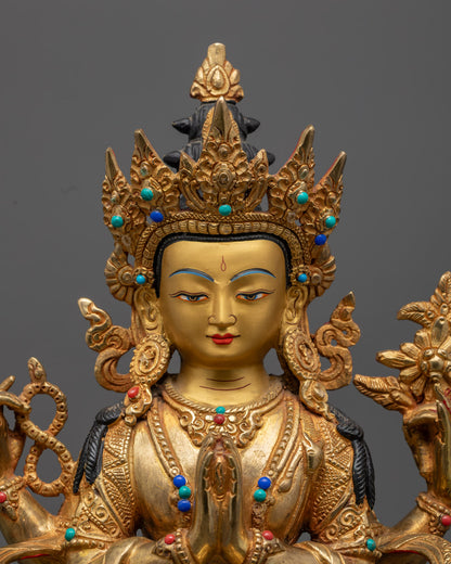 Chenrezig statue holding Akshamala, lotus, and Cintamani – symbols of compassion and spiritual purity