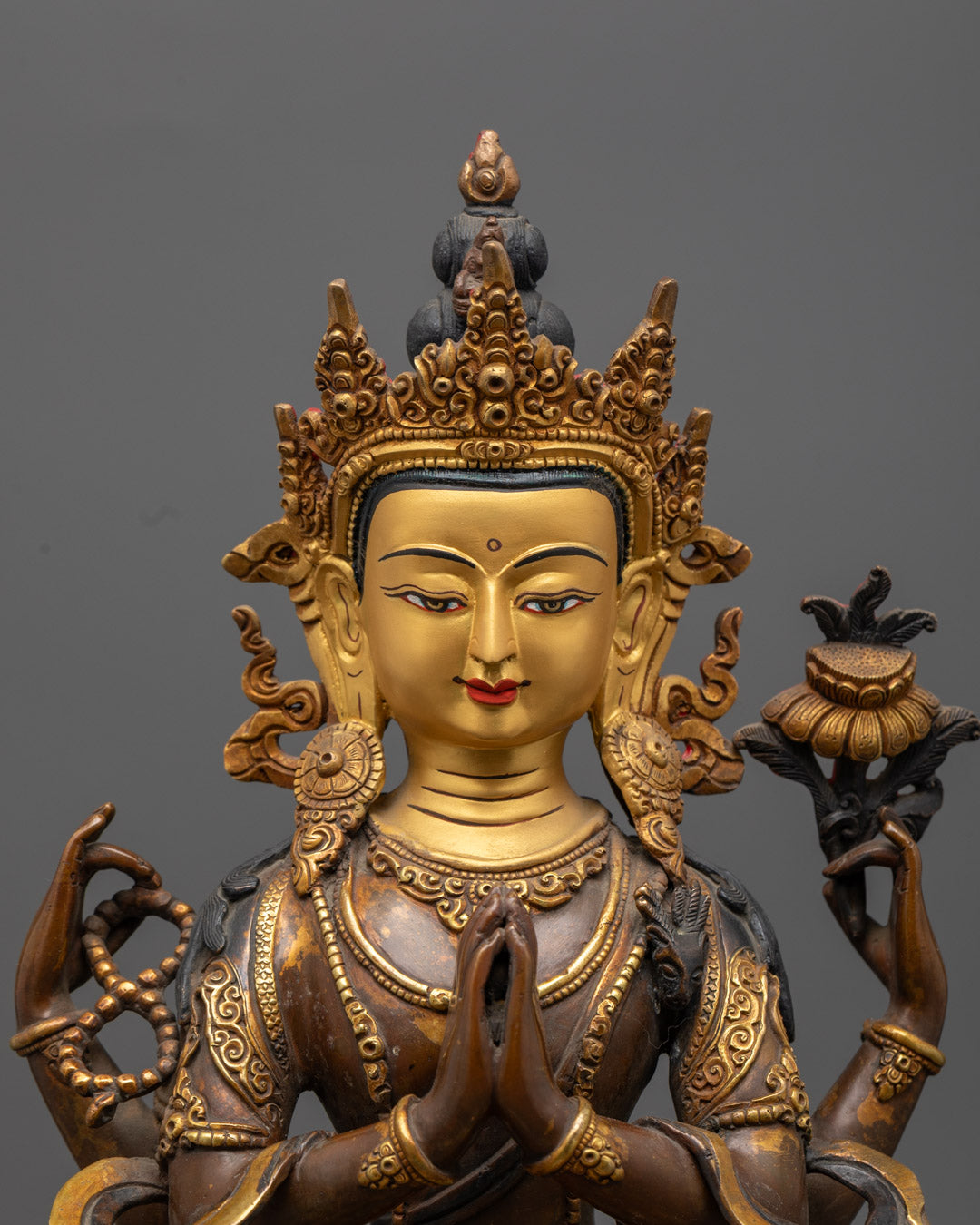 Chenrezig statue’s detailed floating robe, crown, and jewelry carved by skilled artisans