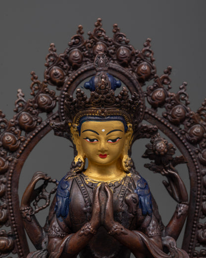 Close up of Chenrezig statue’s gold-plated face and five-jeweled crown with rosary detail