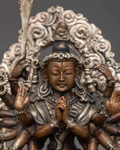 Chundi Devi statue displayed on a Tibetan altar, surrounded by candles and prayer items, invoking blessings and divine protection.