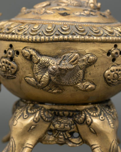 Close-up intricate relief carvings on brass incense burner bowl handcrafted Nepal