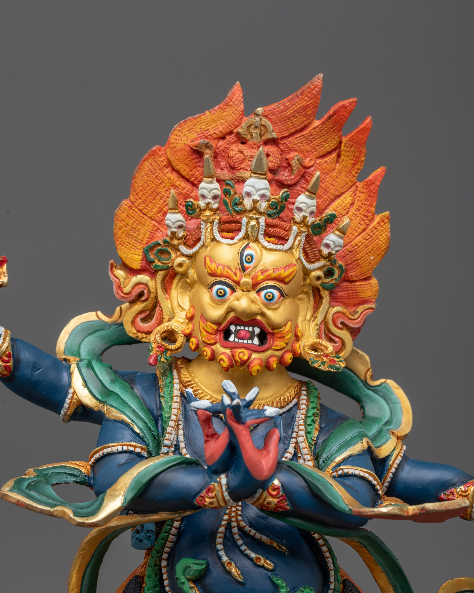 Close-Up View of Vajrapani Sculpture’s Fierce Expression and Vajra Weapon