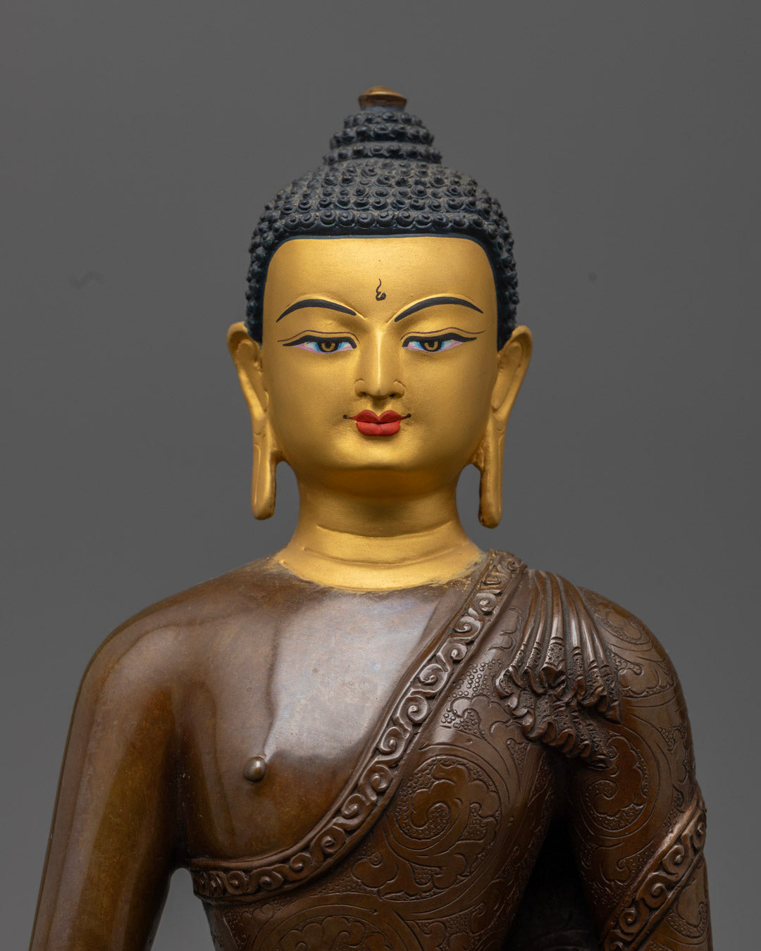 Amitabha Buddha Statue’s 24k gold-coated face, radiating sacred energy and divine serenity – representing enlightenment and rebirth in the Pure Land.