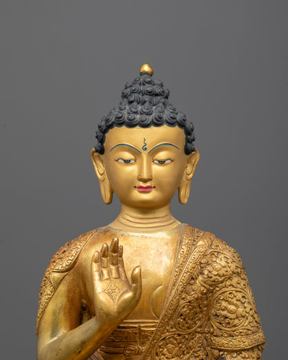 Close-Up of Amoghasiddhi Buddha’s Intricate Gold Detailing and Facial Features