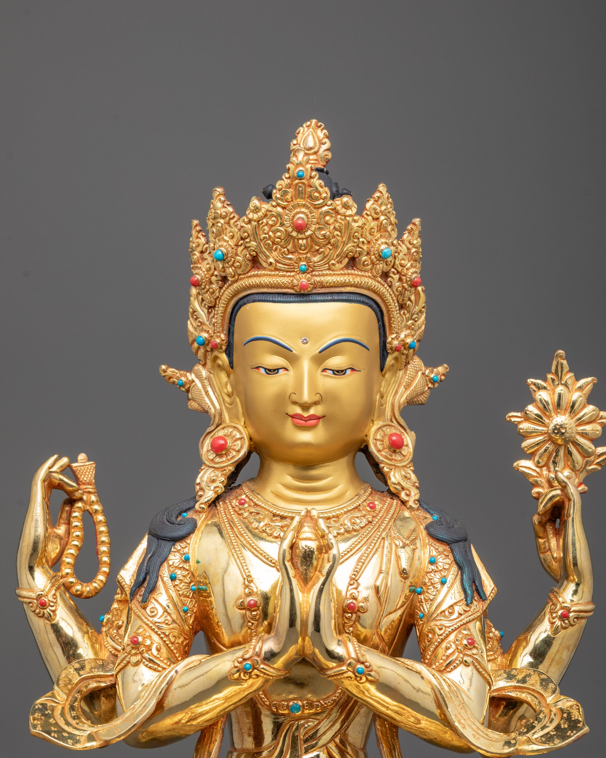 Close-Up of Chenrezig’s Serene Expression and Intricate Detailing in Fire Gold Finish