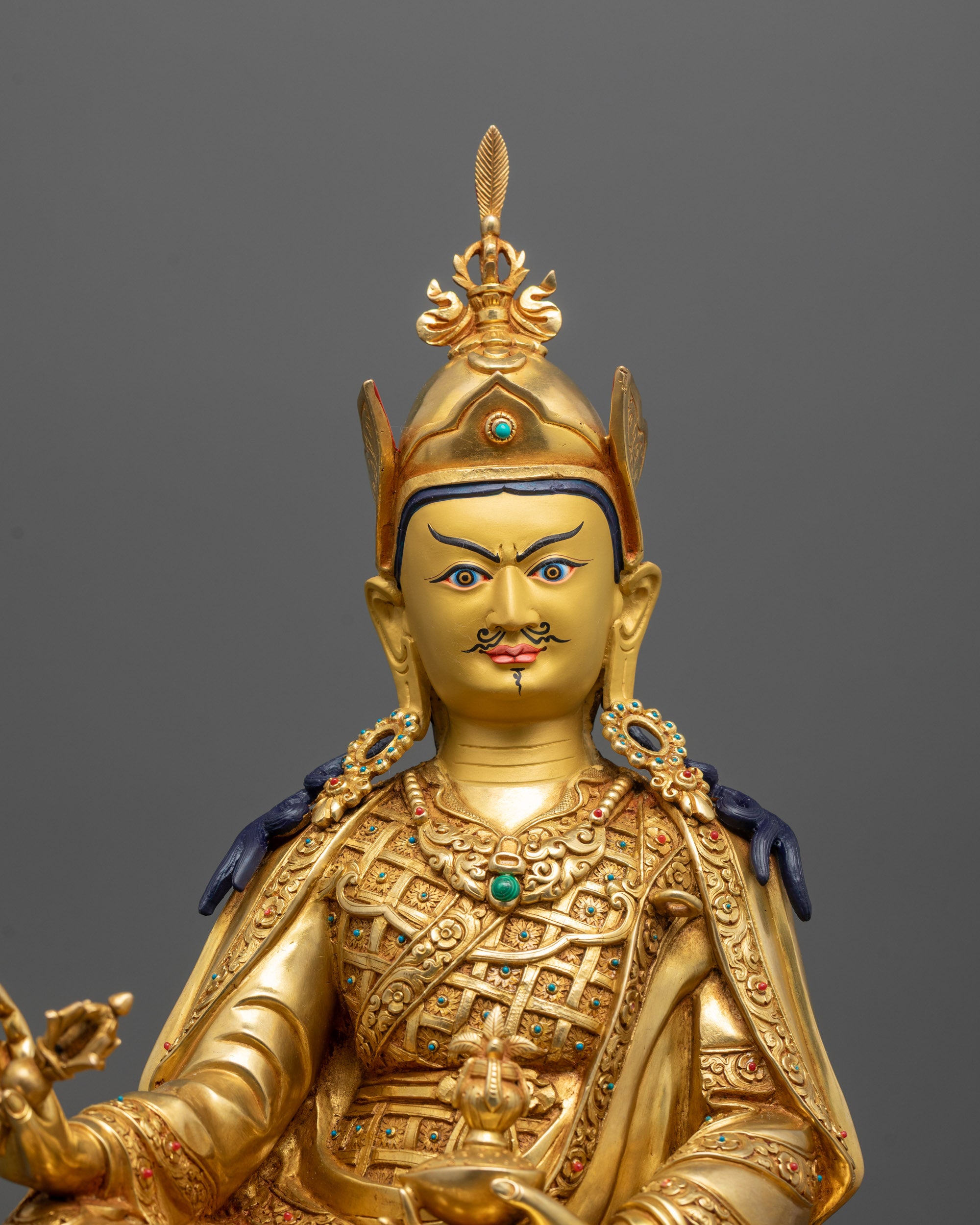 Close-Up of Guru Rinpoche Statue’s Semi-Wrathful Expression and Intricate Crown