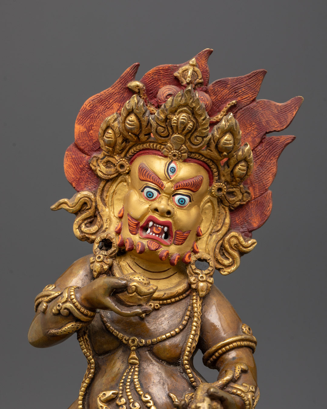 Close-Up of Intricate Detailing on Black Dzambhala Sculpture with Hollow Chamber
