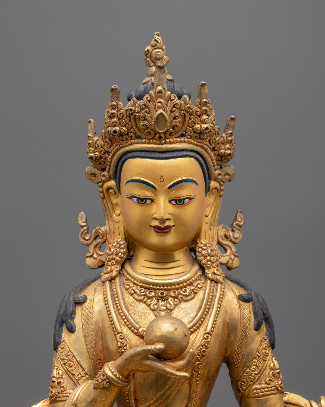 Close-Up of Kshitigarbha's Serene Face with Fire-Gilded Gold Detailing and Jewel-Encrusted Ornaments