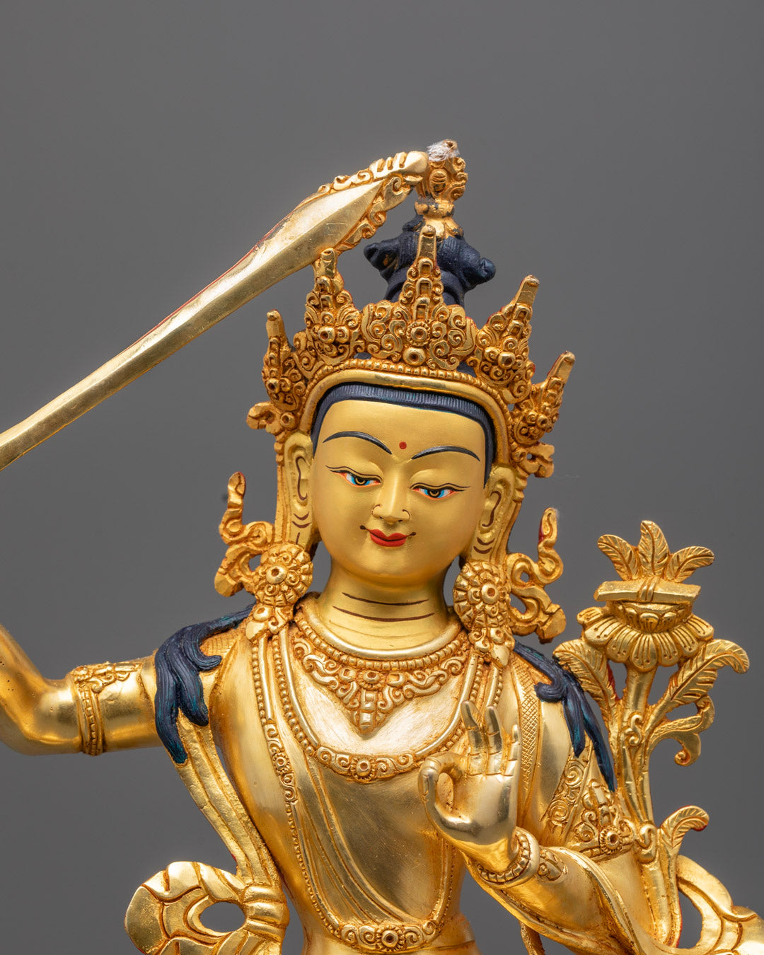 Manjushri Bodhisattva Holding Wisdom Sword and Lotus Scripture on a Lotus Throne