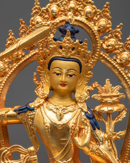 Close-Up of Manjushri Buddha Sculpture Holding Flaming Sword