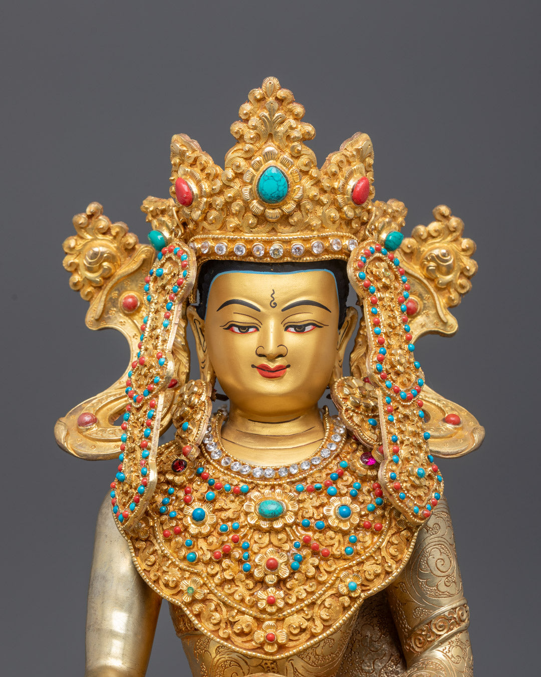 Close-Up of Shakyamuni Buddha's Serene Face Gilded in 24k Gold and Adorned with Semi-Precious Stones