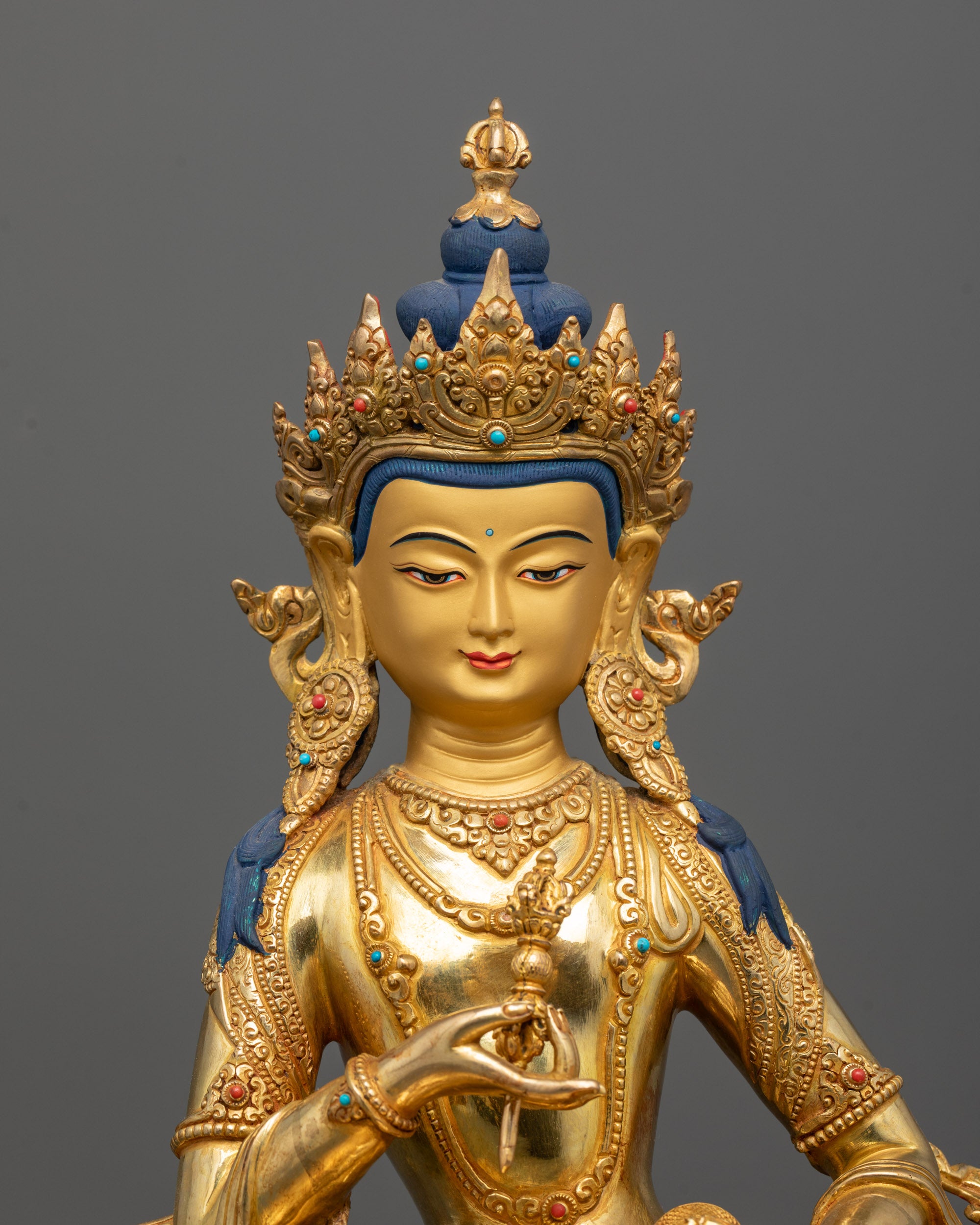 Close-Up of Vajrasattva Statue Holding Vajra and Bell