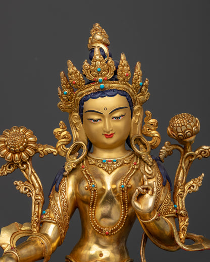 Close up Green Tara sculpture Varada Mudra Vitarka Mudra Utpala flower Buddhist deity