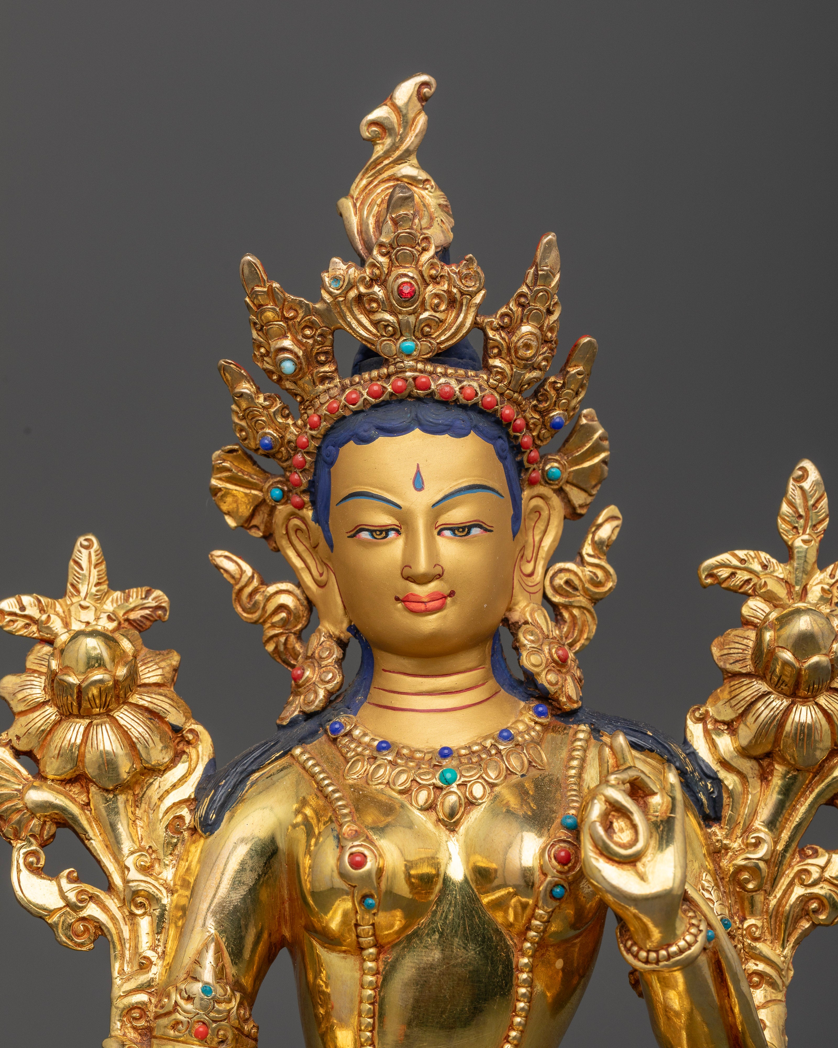 Close up Green Tara sculpture semi-precious stones crown detail meditation Buddhist deity