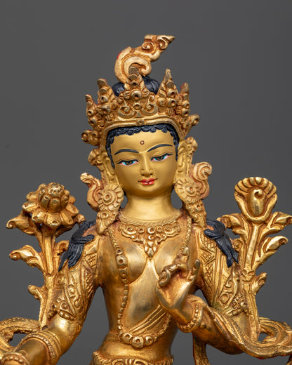 Close up Green Tara statue crown detail gold face Himalayan meditation sculpture