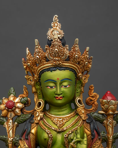 Close-up of Green Tara statue, intricate 3D carvings and vibrant hand-painted finish