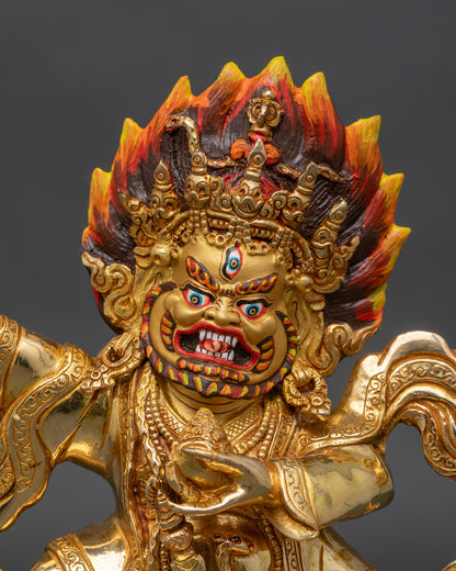 Close up view of Mahakala Bernagchen face wrathful expression gold-painted Nepalese Buddhist deity