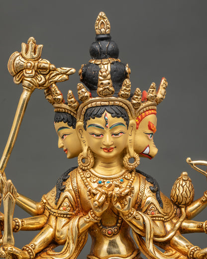 Close up Marichi statue gold-painted face intricate carvings details