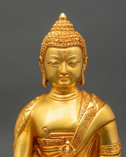 Close up Mitrugpa statue gold fire-gilded face intricate carvings Himalayan Buddhist art