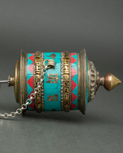 Close up Tibetan Handheld Mantra Wheel semi precious stones turquoise coral