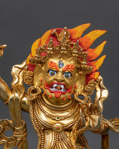 Close up Vajrapani face fierce expression gold painted details vajra Buddhist sculpture