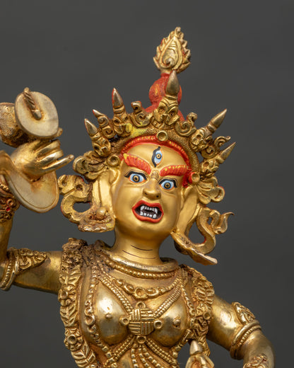 Close up gold painted face Yumka Dechen Gyalmo statue Himalayan dakini detail