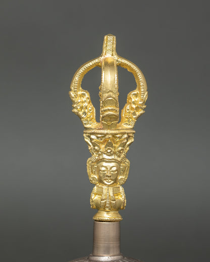 Close up gold plated bell handle with deity carving Tibetan Ghanta detail