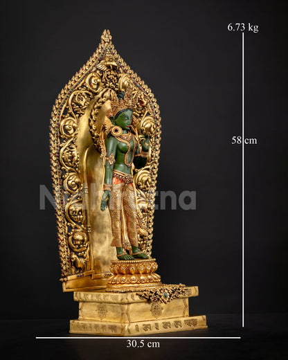 Close up of Green Tara statue genuine Nepali Buddhist art gold gilded copper sculpture adorned with gemstones