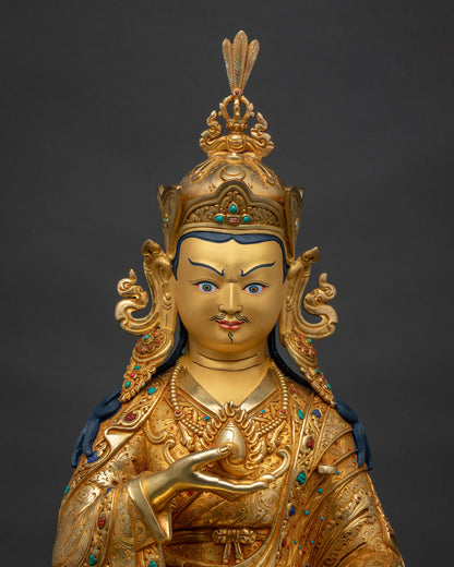 Close-up of Guru Norlha statue, gold fire-gilded kasaya robes with inlaid semi-precious stones
