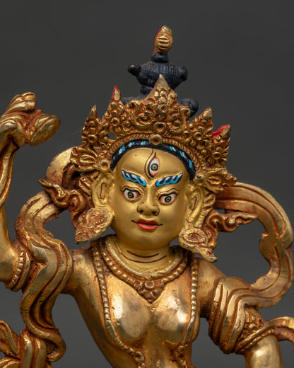 Close up of Machig Labdron Statue holding hand drum and bell intricate carved robes flowing garments Nepal sculpture