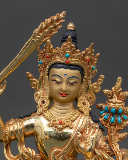 Close-up of Simhada Manjushri statue showing intricate copper and gold craftsmanship