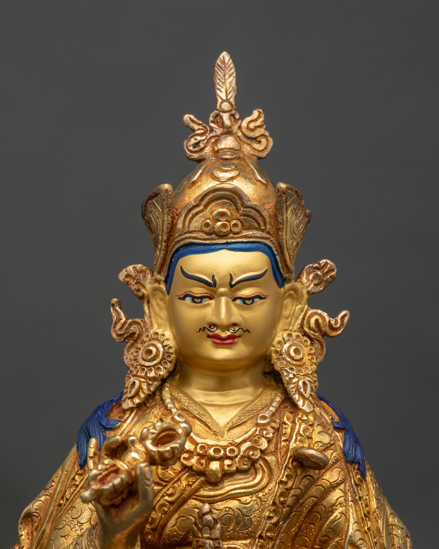 Close-up of Tsokye Dorje statue showing gold gilding and intricate lotus throne details
