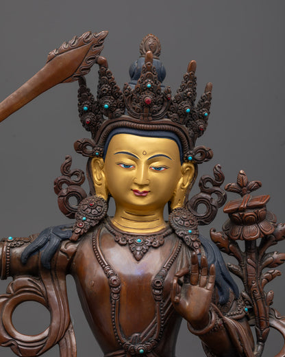 Close-up 24k Gold Gilded Face Manjushri Bodhisattva Statue in Oxidized Copper Finish