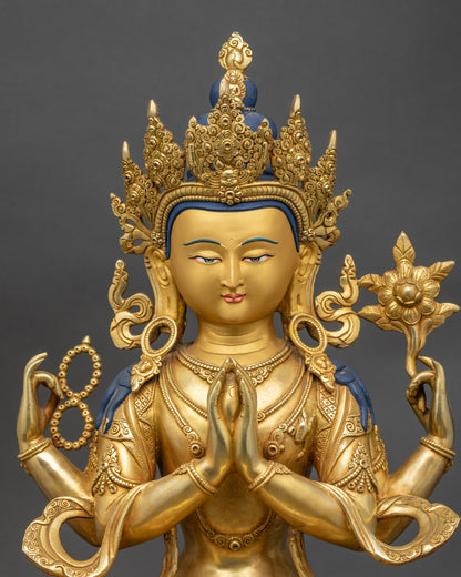 Close-up Chenrezig Buddha crown and hand holding wish-fulfilling jewel, Nepalese artistry