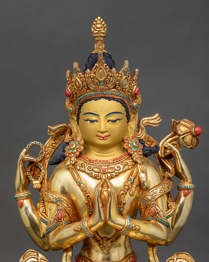 Close-up Chenrezig statue face and hands showing Anjali Mudra and lotus flower