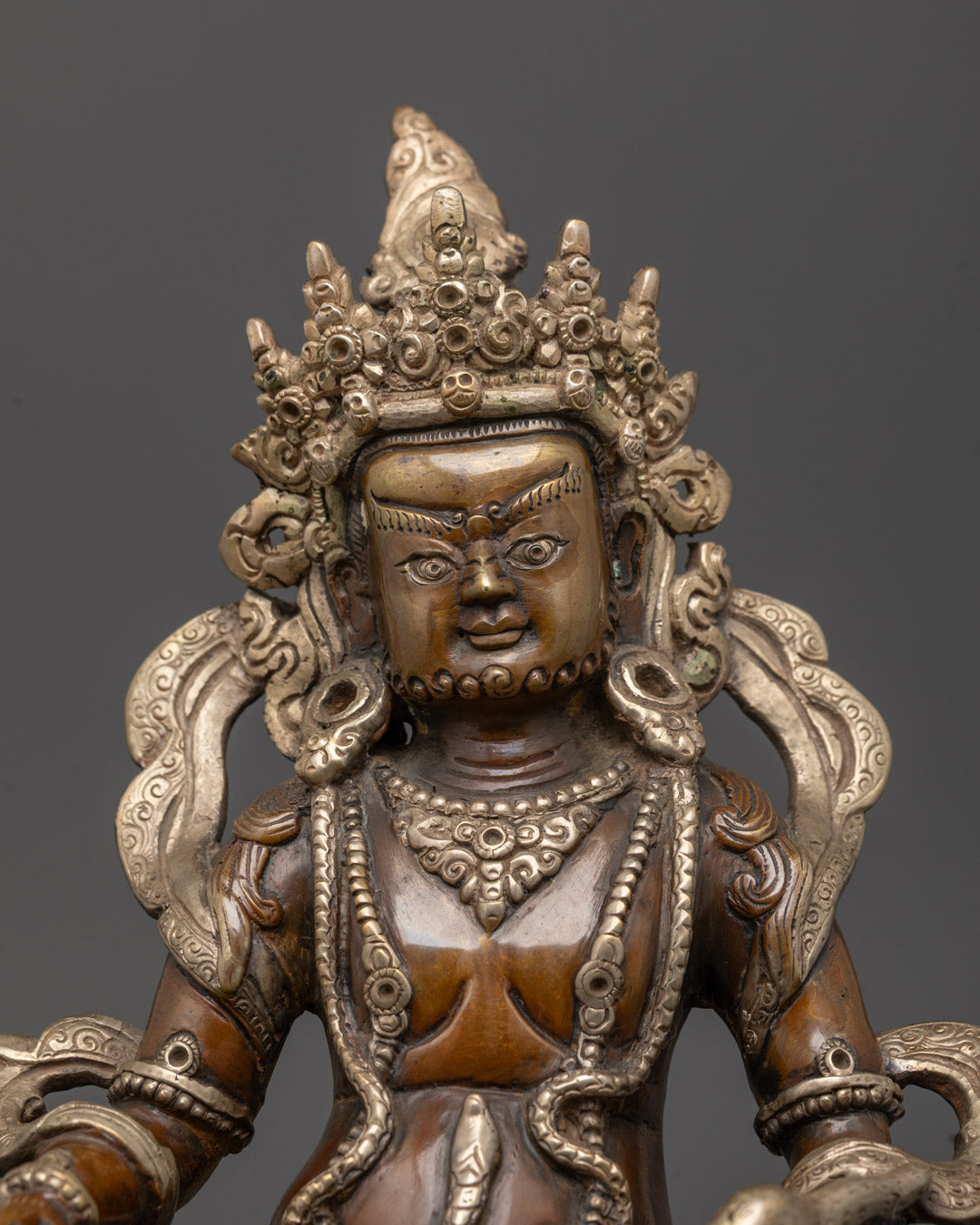 Close-up Dzambhala Mantra Sculpture Nepalese hand-carved details silver oxidized finish