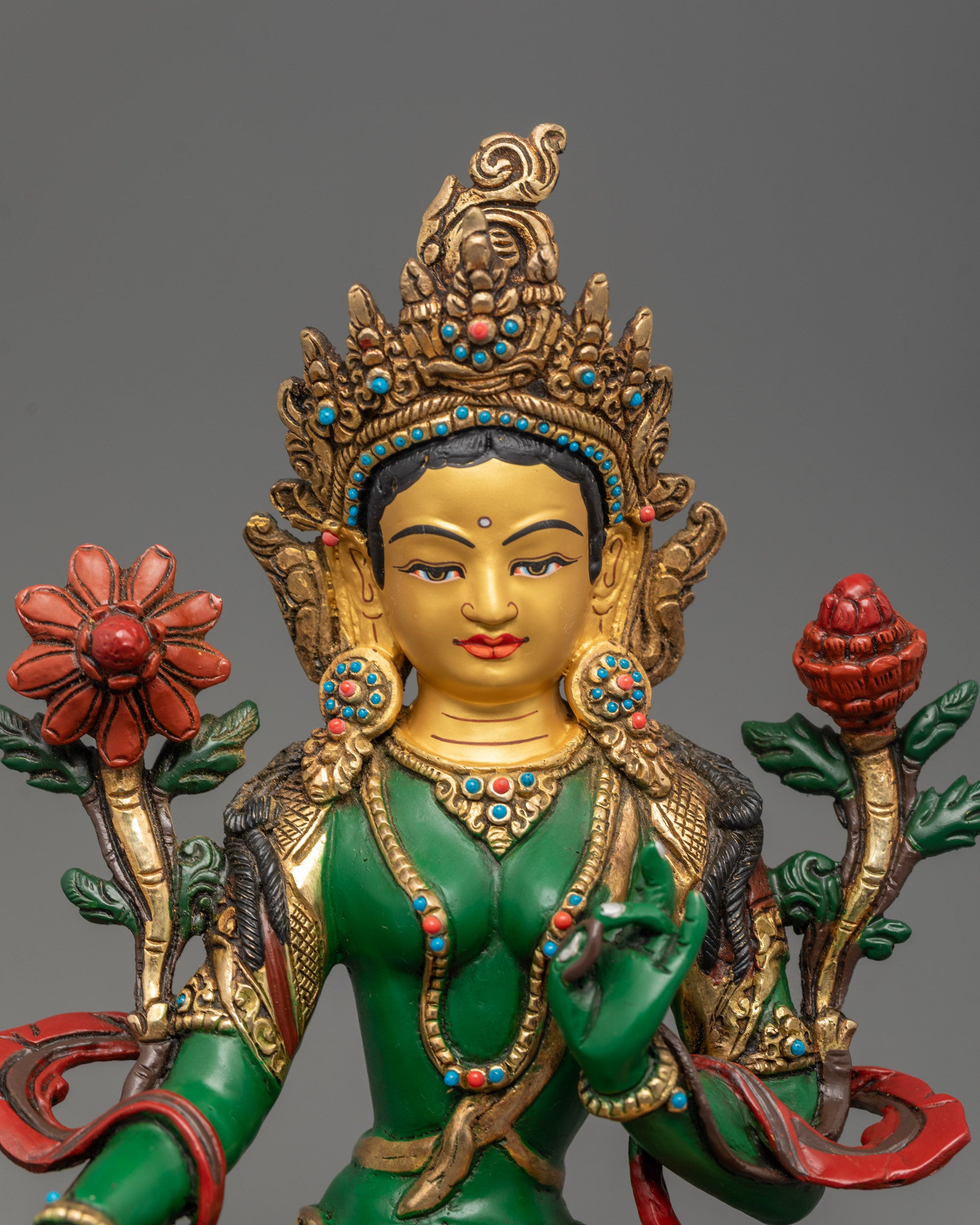 Close-up Green Tara sculpture in varada mudra with vibrant green acrylic finish