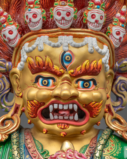 Close-up Mahakala Bernagchen face with third eye and flaying knife in hand