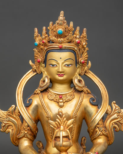 Close-up Nepalese Amitayus sculpture with gold-painted face and semi-precious stonesepal