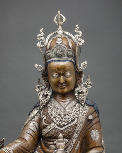 Close-up Padmasambhava statue, oxidized dark finish, silver-plated ornaments, Nepali Buddhist art