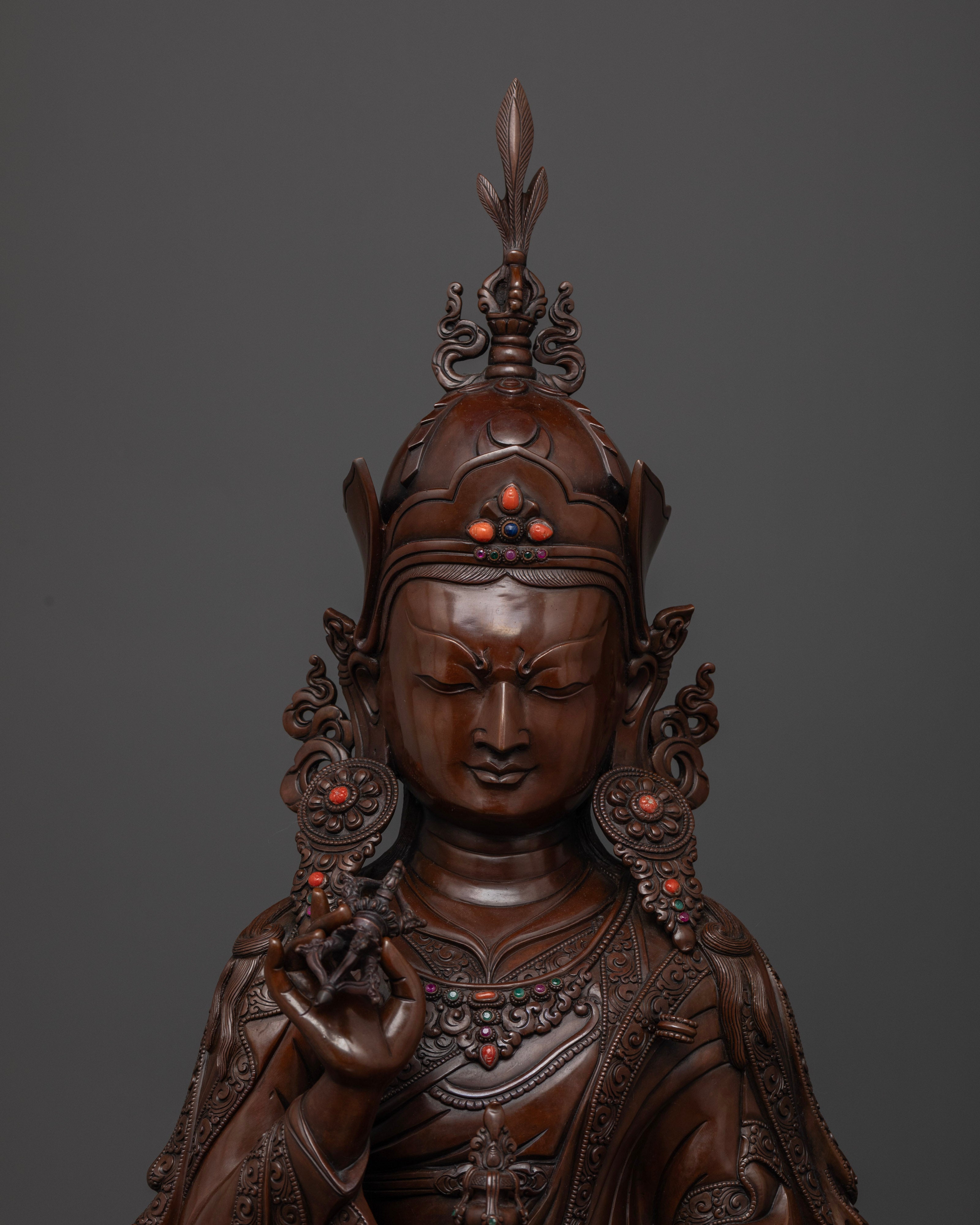Close-up View Padmasambhava statue featuring intricate fire-gilded copper details and traditional Himalayan