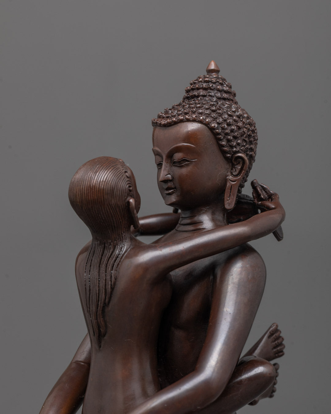 Close-up angle of Jambhala and consort figures with rich acrylic finish and fine details