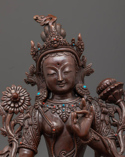 Close-up angle of White Tara's face highlighting third eye and antique oxidized finish details