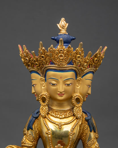 Close-up four-faced Vairocana Buddha statue, jeweled crown, floral motif details