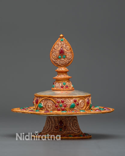 Close-up gold-plated filigree details on copper Mandala Offering tiers