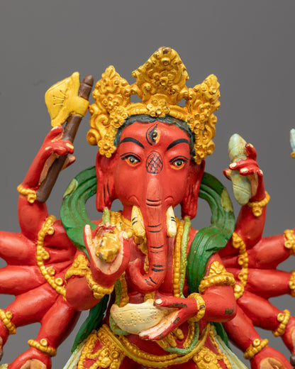 Ganesh statue’s face with detailed crown and serene expression, showcasing traditional Buddhist-Hindu artistry.