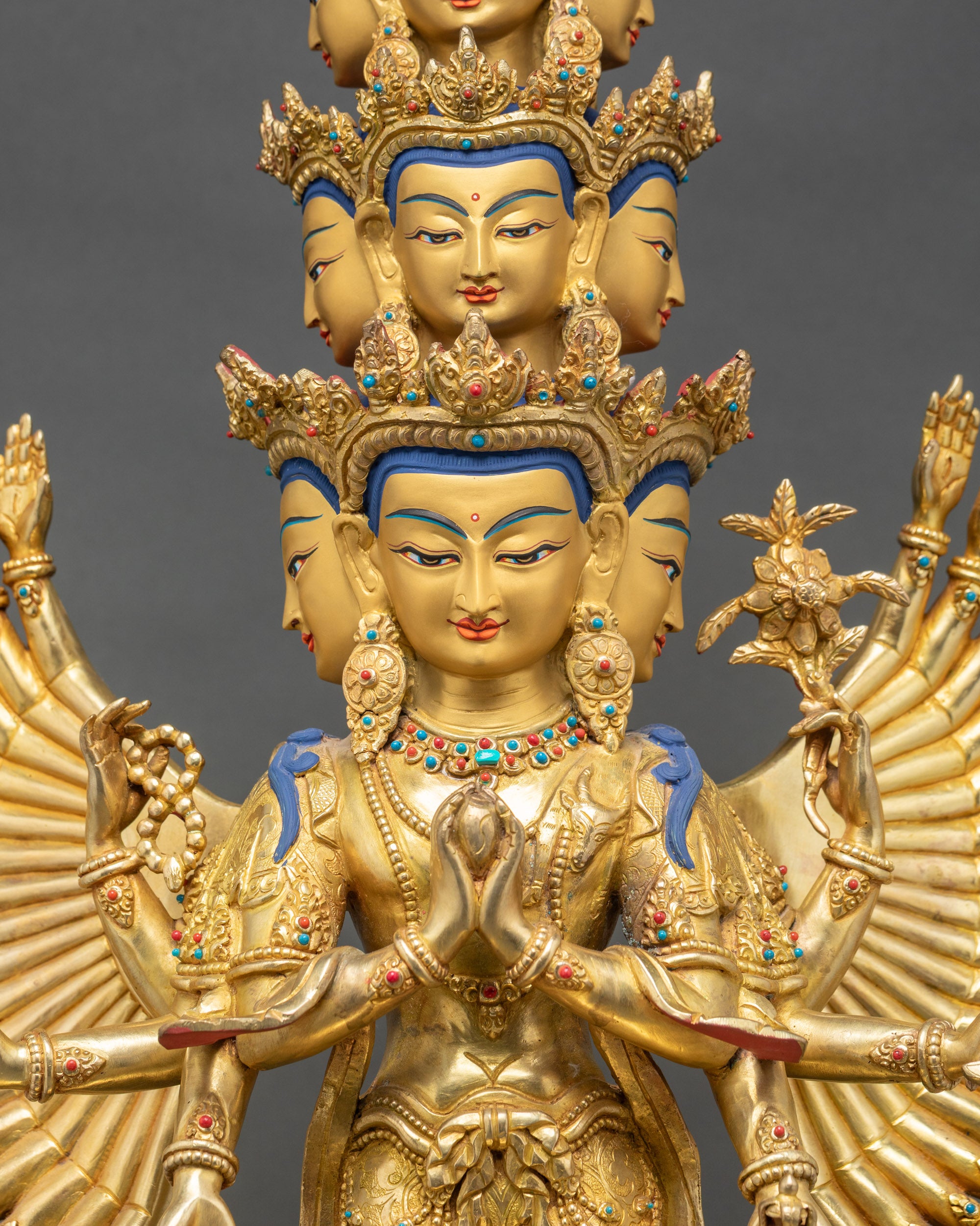 gold-painted serene expression with intricate detailing on handcrafted copper Bodhisattva statue.