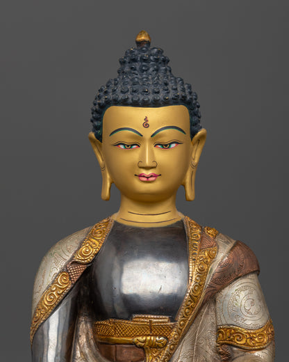 Close-up of 24K gold painted face of Sakyamuni Buddha statue from Patan